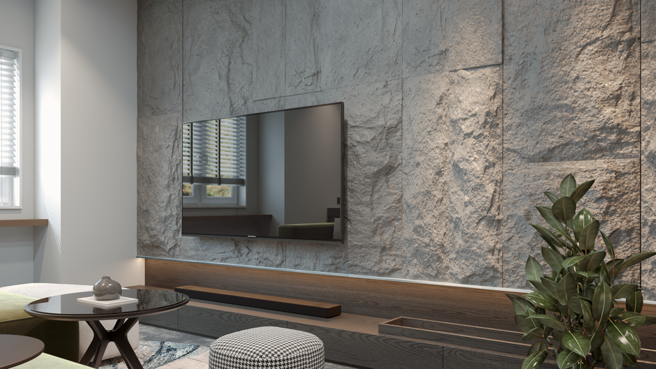 Contemporary living room featuring a mounted TV on a textured stone wall with modern decor.